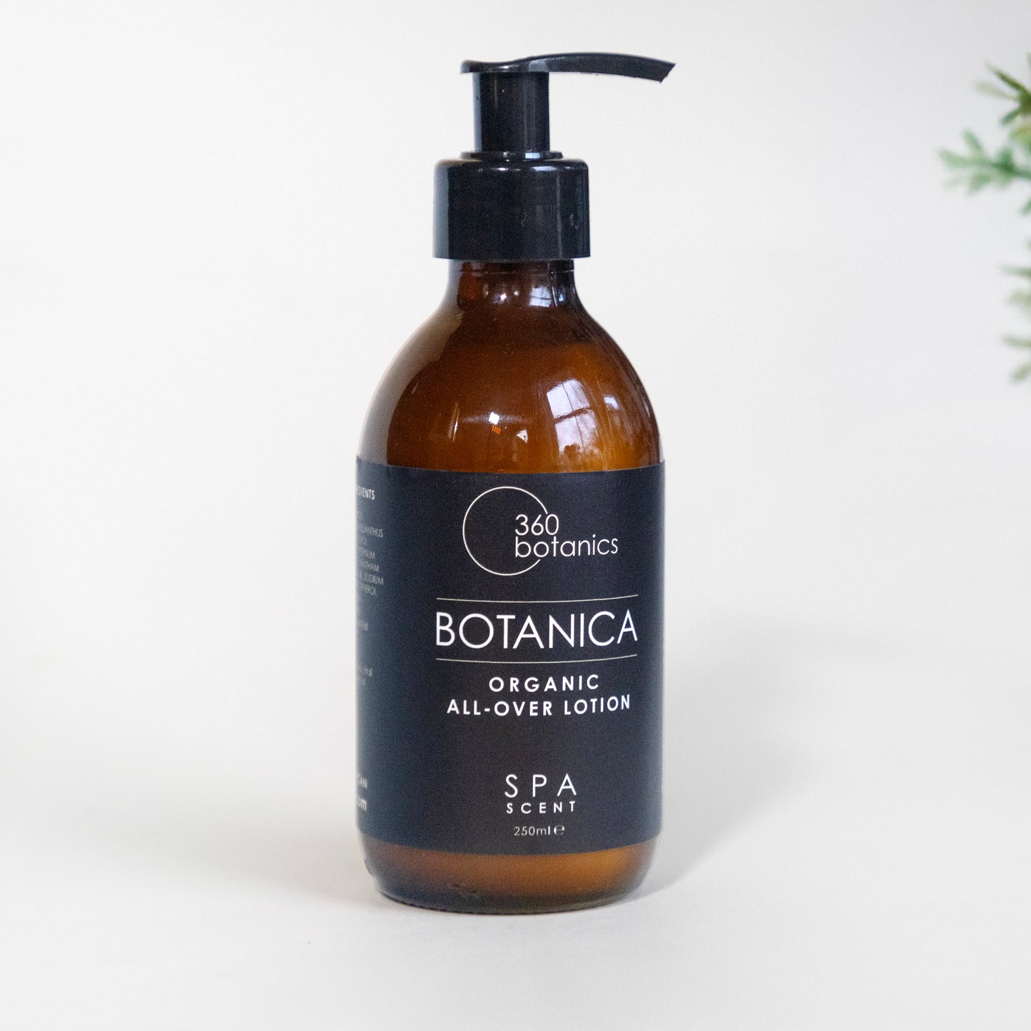 360 Botanics Botanica Organic All-Over Lotion in an amber bottle with a pump dispenser, featuring a sleek black label, displayed on a white background