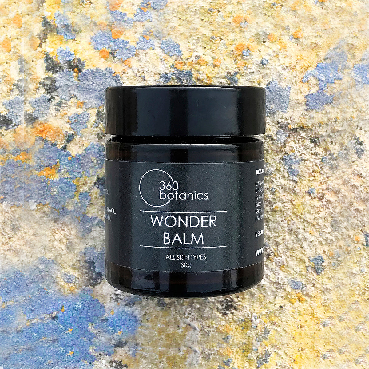 360 Botanics Wonder Balm displayed against a natural stone background