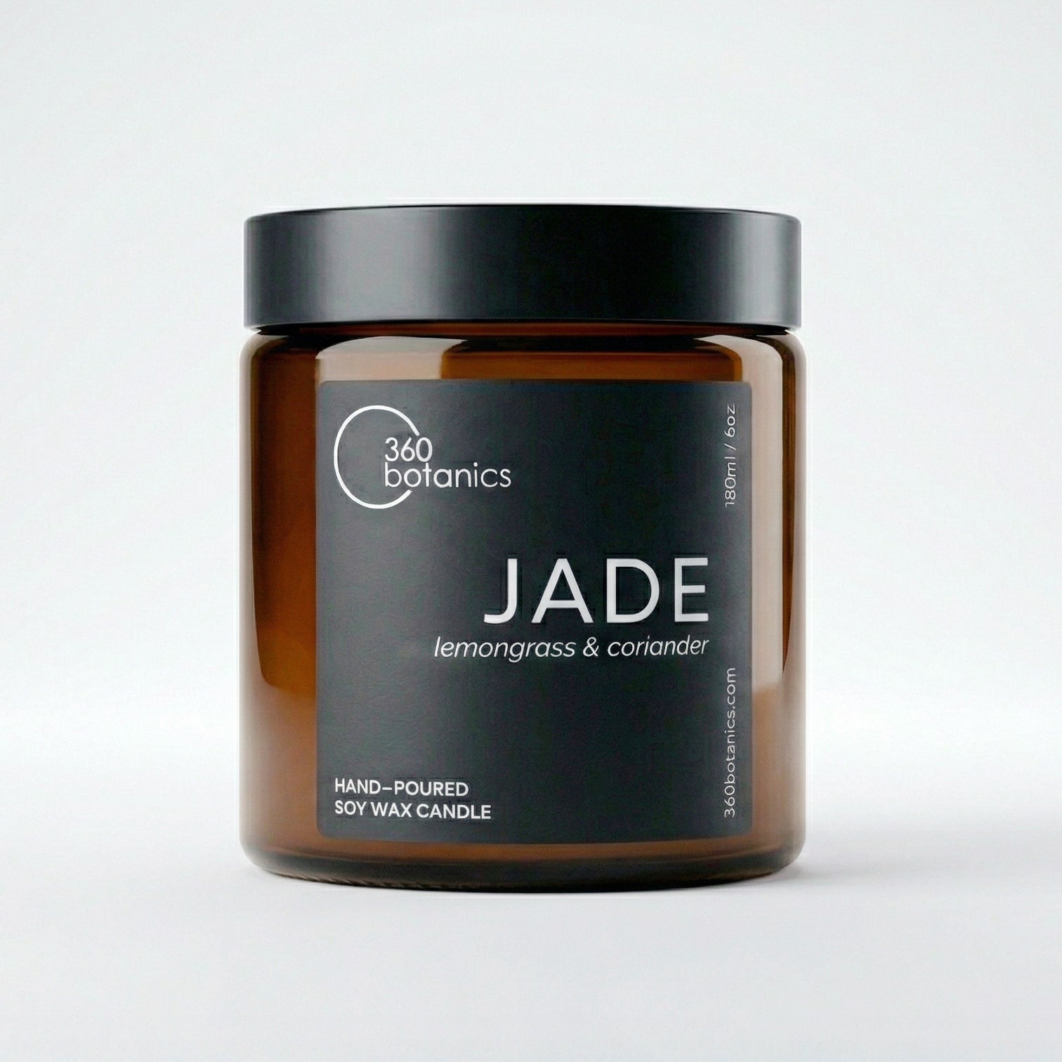 Candle jar labeled 'Jade' by 360 Botanics with a black lid on a light grey background