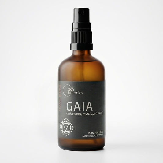 Amber glass spray bottle with black pump labeled “360 Botanics GAIA,” a 100% natural mood boost mist featuring cedarwood, myrrh, and patchouli.