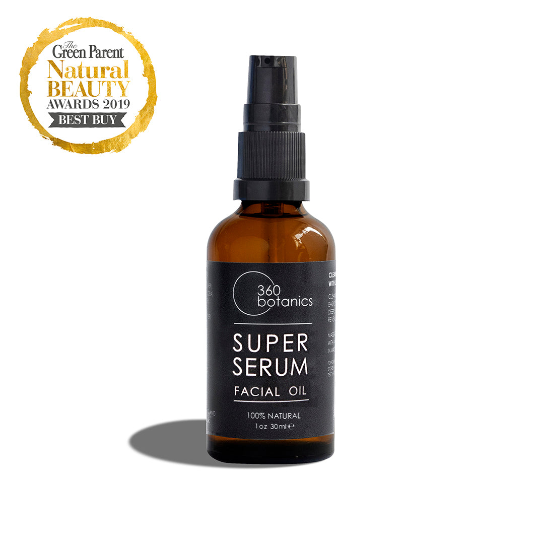 A bottle of 360 Botanics Super Serum Facial Oil labeled as 100% natural in a 1 oz or 30 ml size, with a spray nozzle. To the upper left is a badge stating "The Green Parent Natural Beauty Awards 2019 BEST BUY" against a white background.