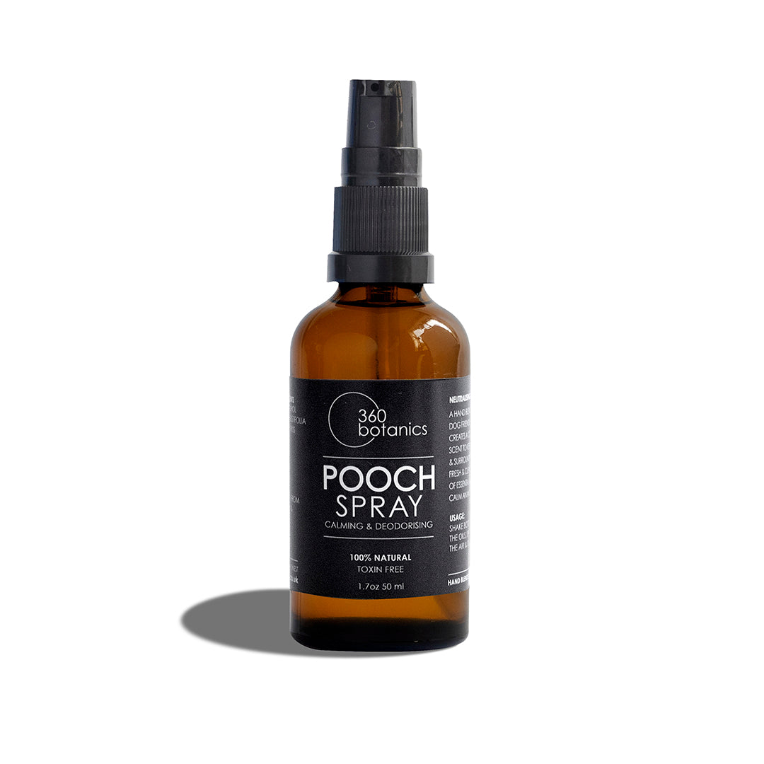 A bottle of 360 Botanics Pooch Spray stands against a white background, casting a soft shadow. The label states 'Calming & Deodorising', '100% Natural Toxin Free', and '1.7oz 50 ml', promoting a safe and natural care product for pets