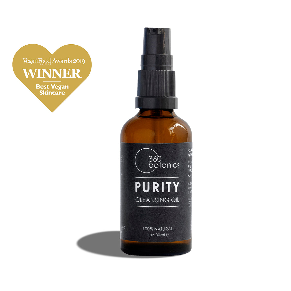 A 360 Botanics Purity Cleansing Oil bottle with a spray nozzle is displayed against a white background. Above the bottle is a golden heart graphic with the text 'Vegan Food Awards 2019 WINNER Best Vegan Skincare', signifying the product's quality and ethical accolades