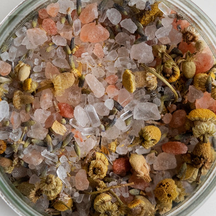 photography of deep sleep bath salts jar looking down at the salts with the jar open