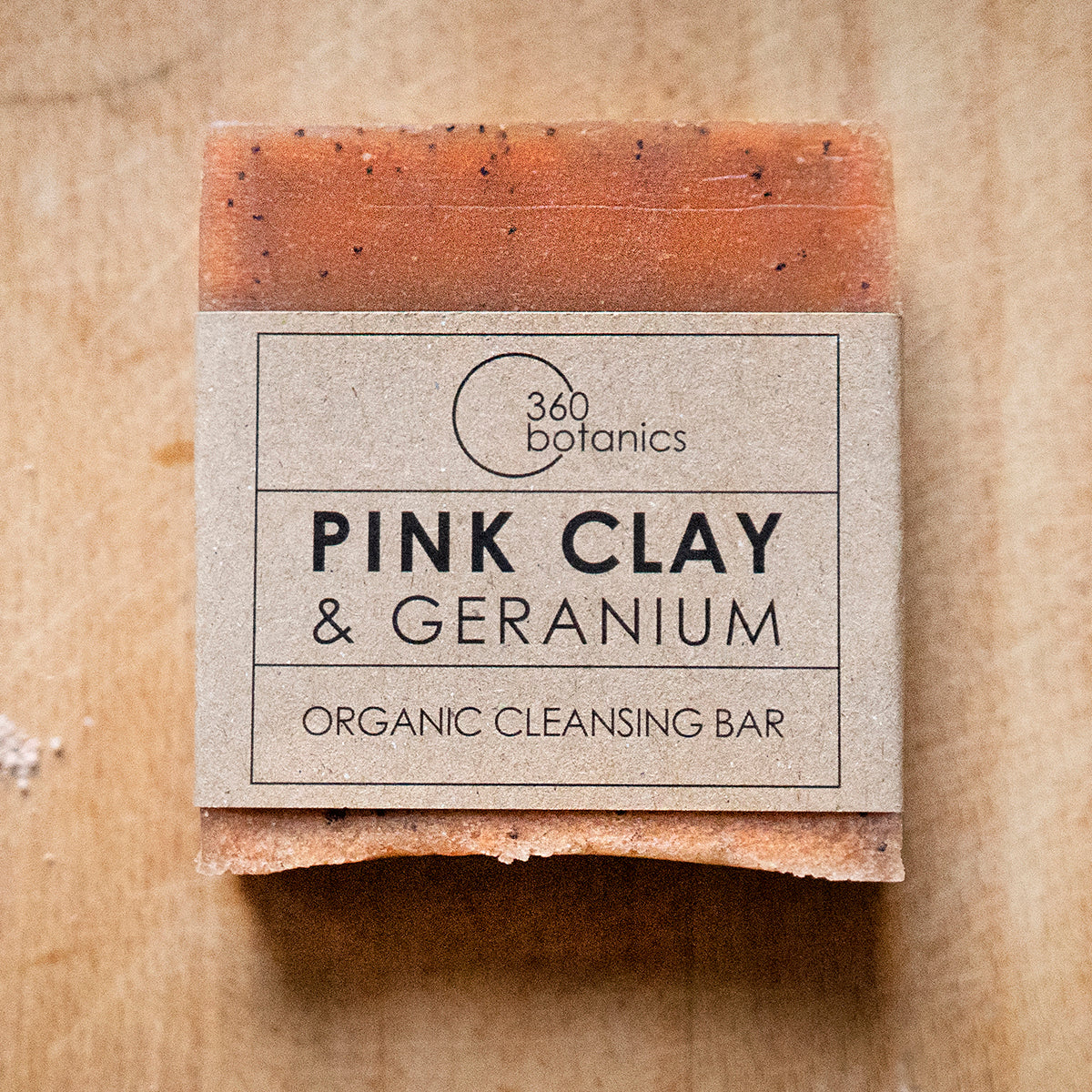 Pink clay and geranium soap photographed on grey marble