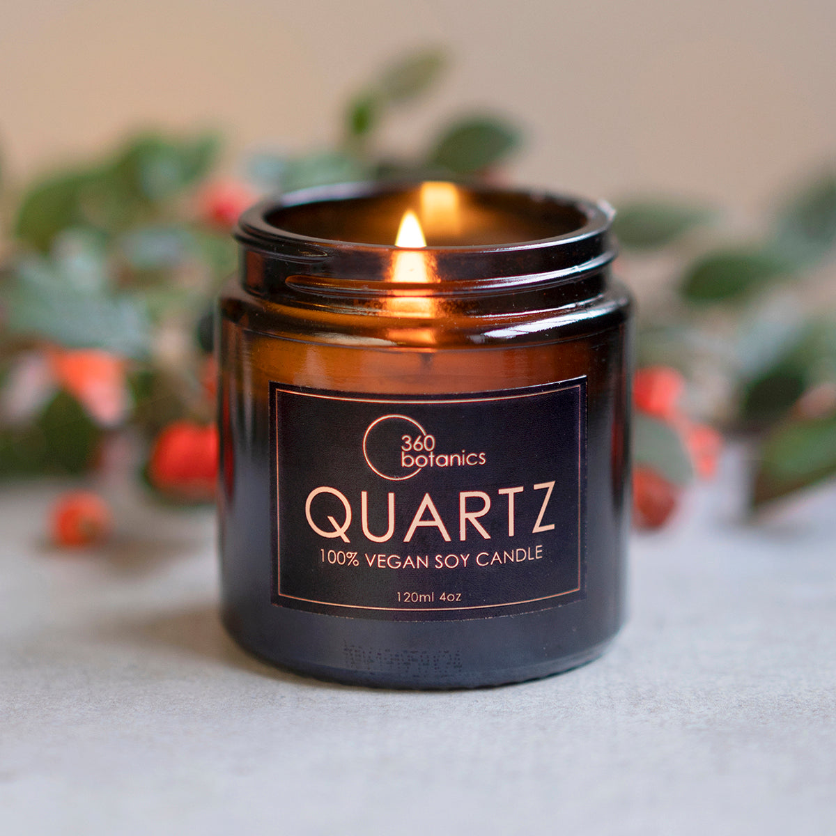 Image of Quartz Vegan soy candle photographed with Christmas berries